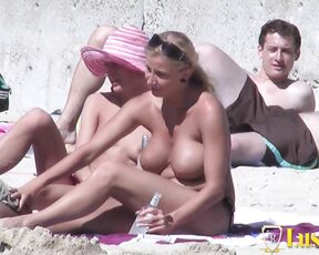 Beautiful busty Anna and hot chick Nadine at the nude beach